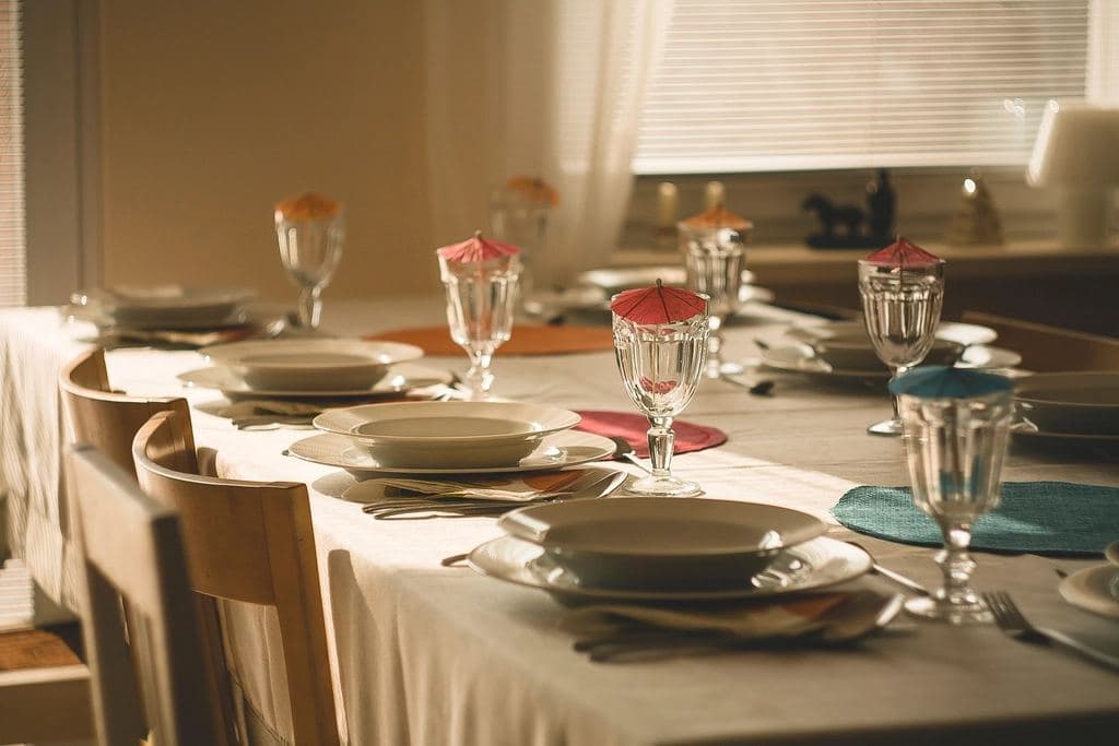 Restaurant tables set with wine glasses
