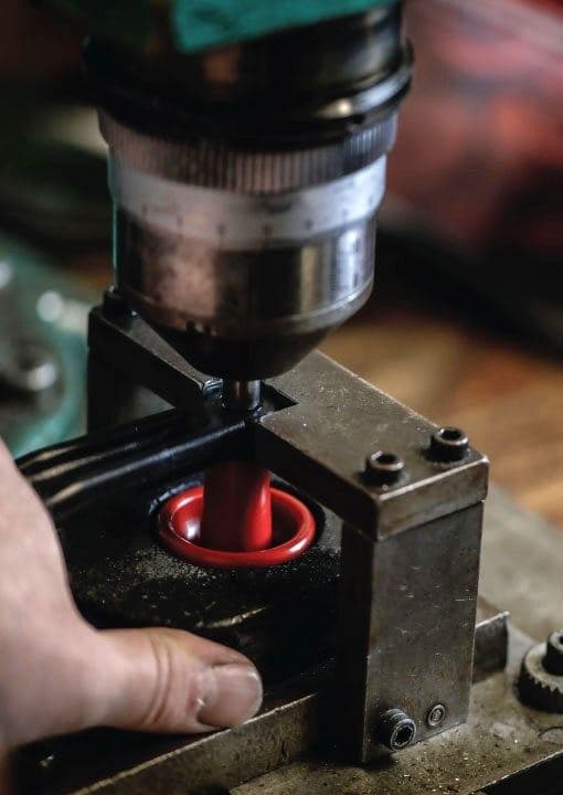 A part being machined on a drill press in the Bonzer workshop