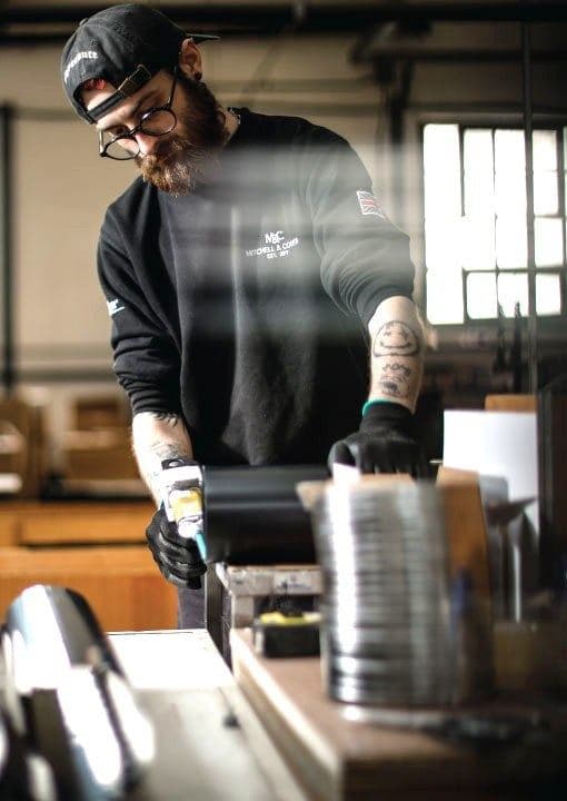 A technician at work in the Mitchell & Cooper factory