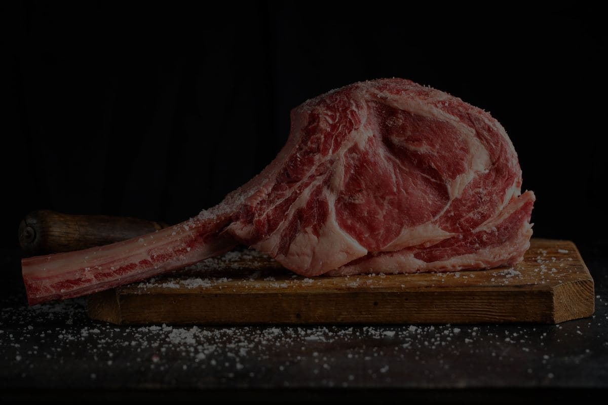 Tomahawk steak on a wooden board