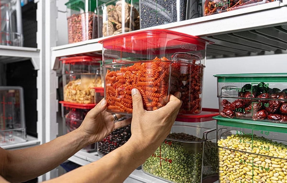 Cambro food storage containers on kitchen shelving