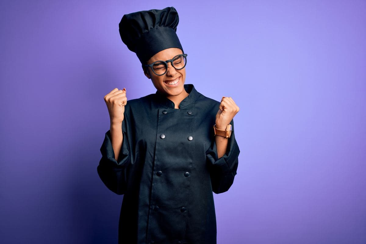 Chef in a black chef's jacket and toque