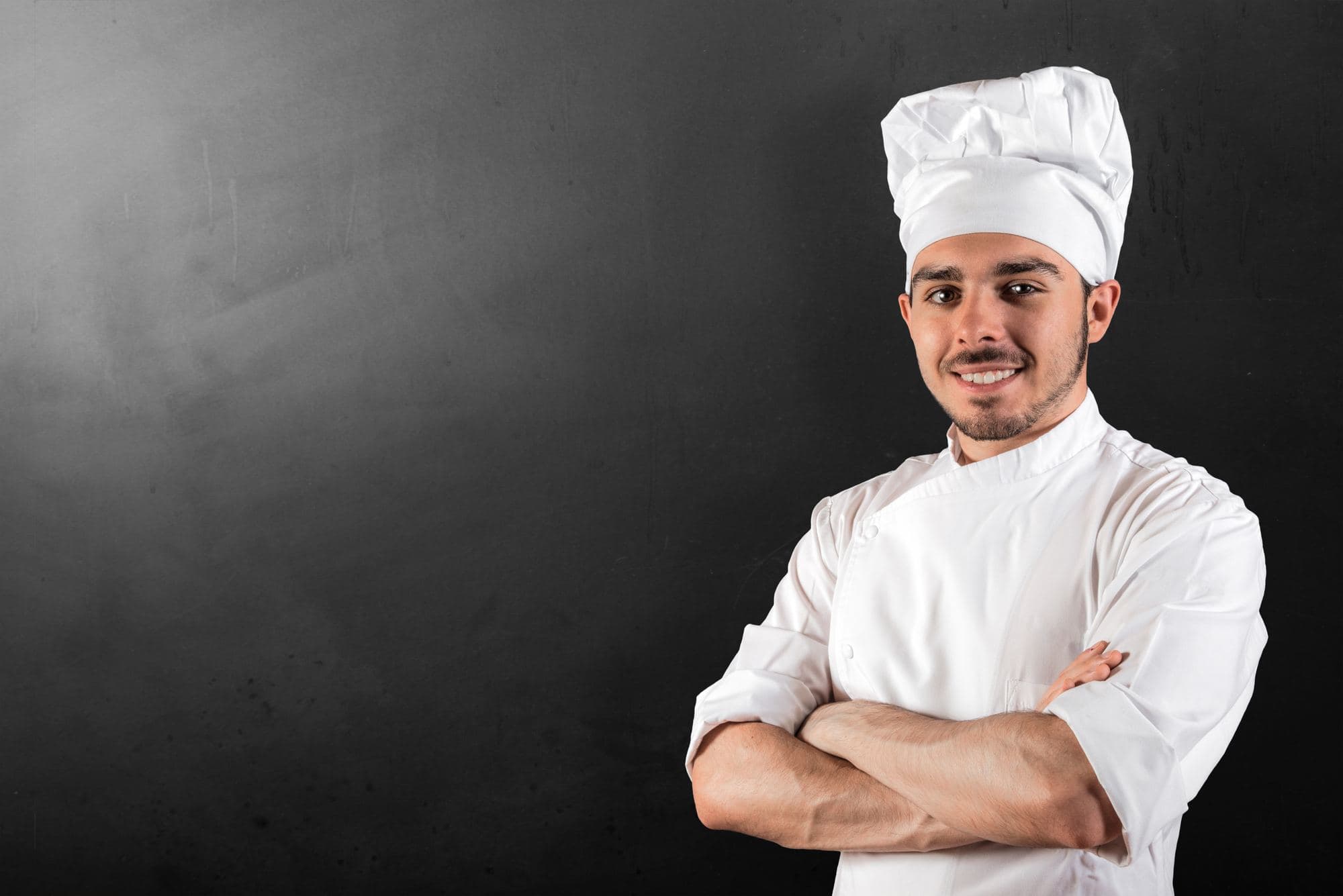 Chef in a white chef's jacket and hat