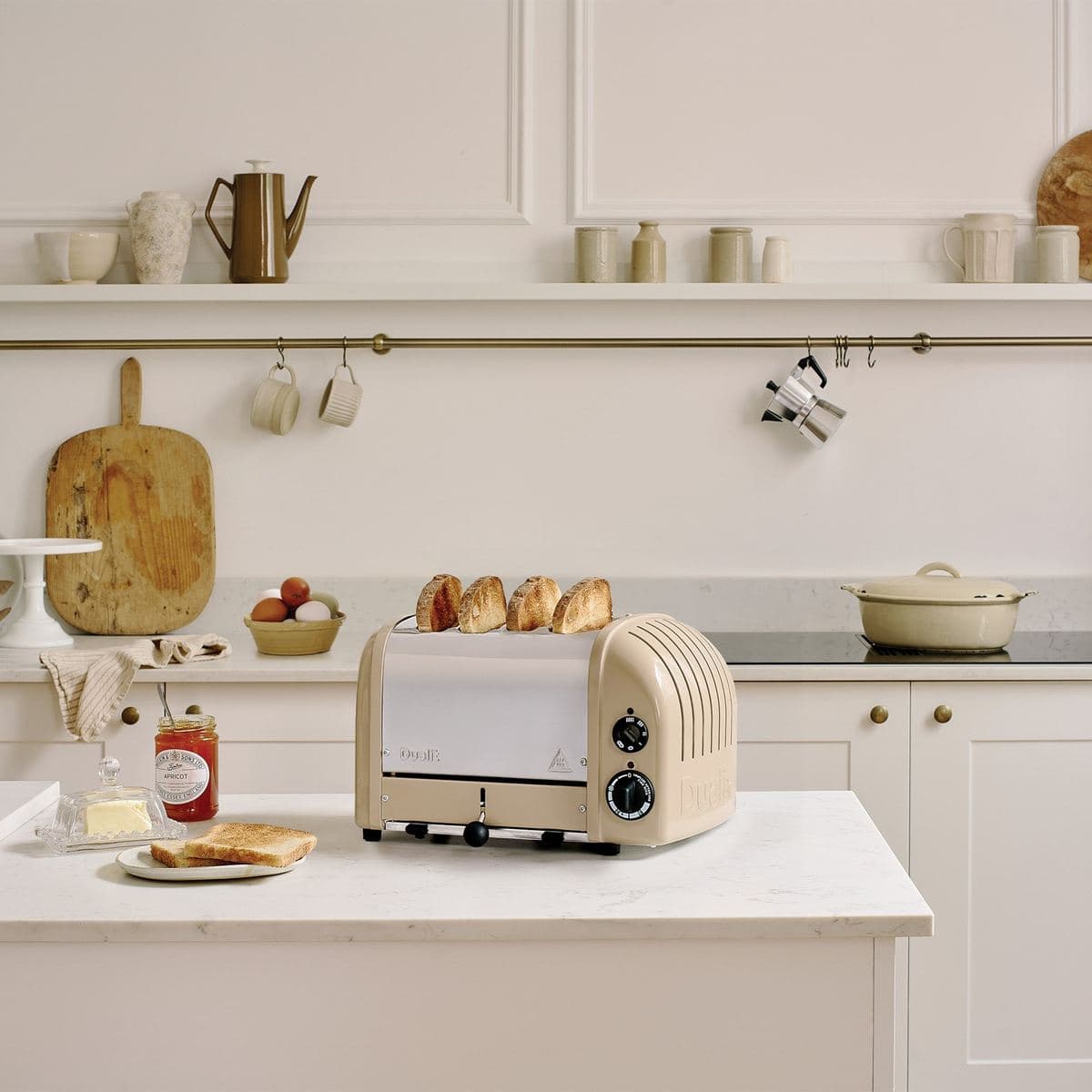 A cream Dualit Classic toaster with fresh toast