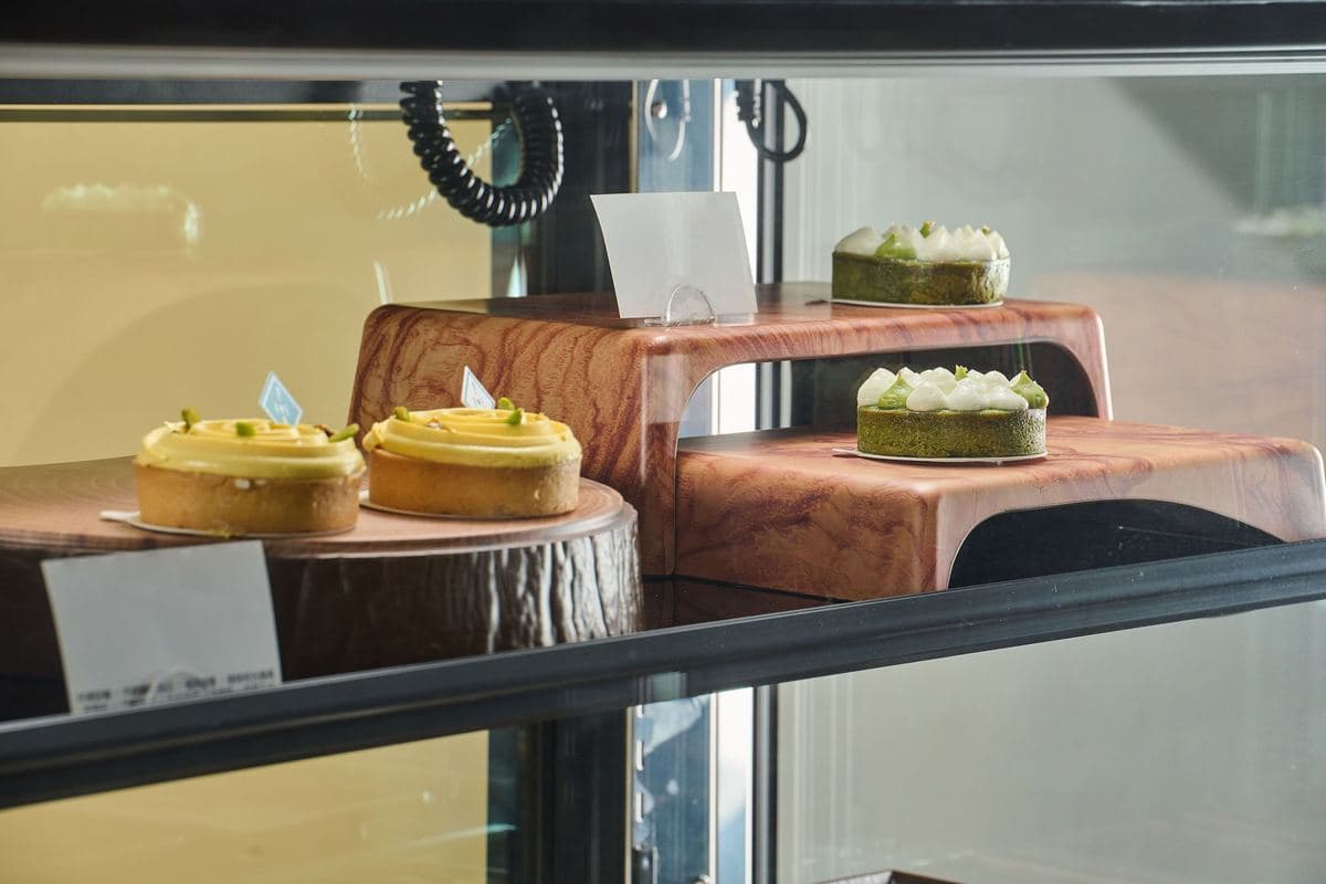 Cakes displayed on Efay stands in a chiller
