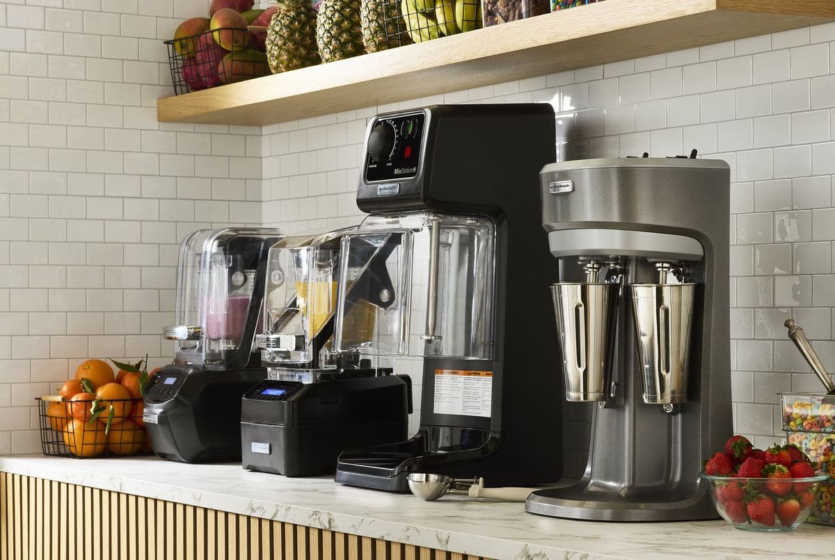 Hamilton Beach blenders and drink mixers on a smoothie-bar counter