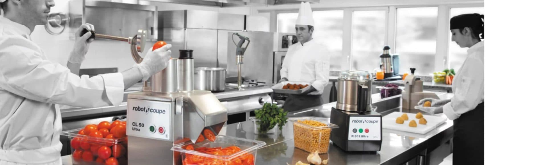 Chefs preparing food with Robot Coupe machines