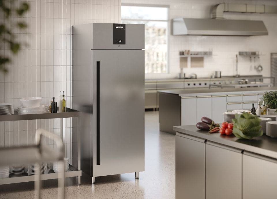 Smeg upright refrigerator in a professional kitchen