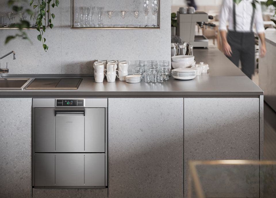 Smeg undercounter dishwasher fitted into a café counter