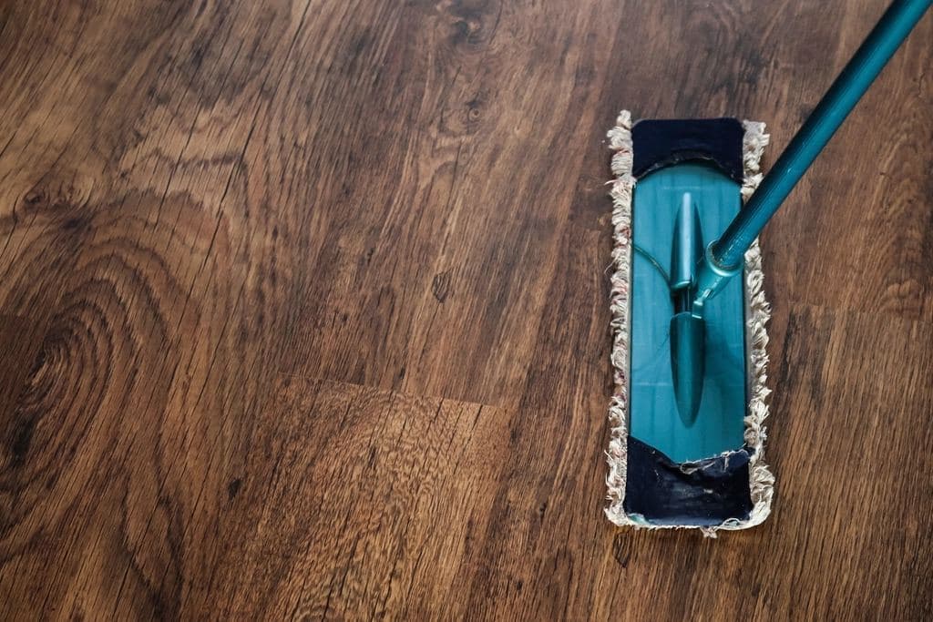 Flat mop on a wooden floor, from above