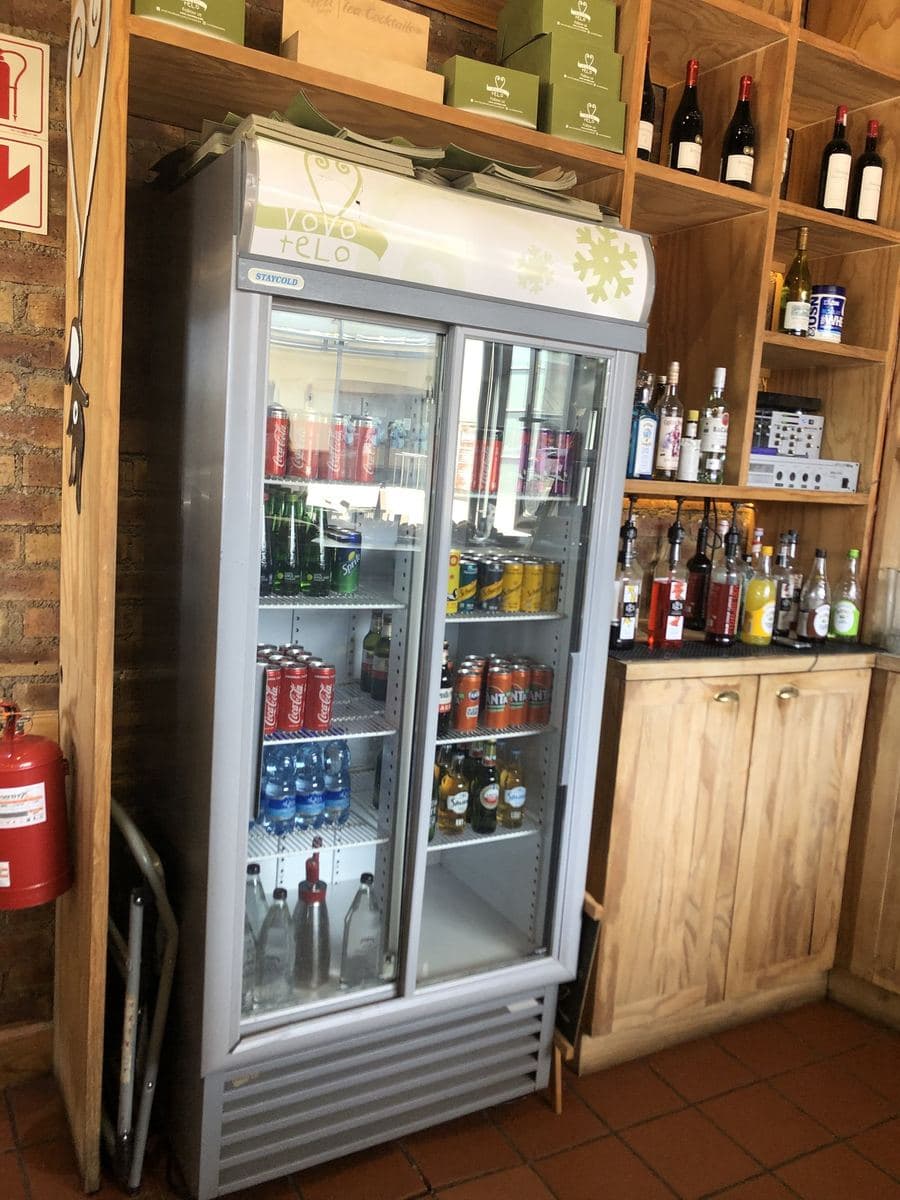 Staycold sliding-door cooler in a wood-panelled bar
