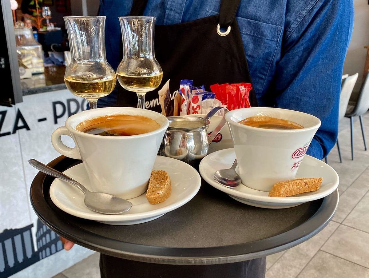 Waiter carrying coffees on a Tuff Tray