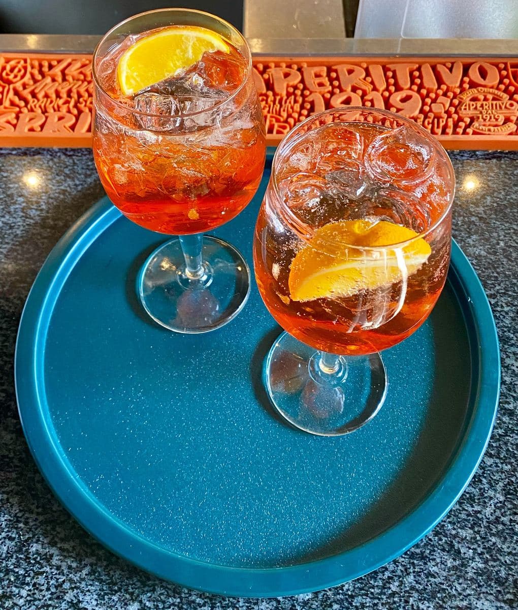 Two spritzes on a teal Tuff Tray